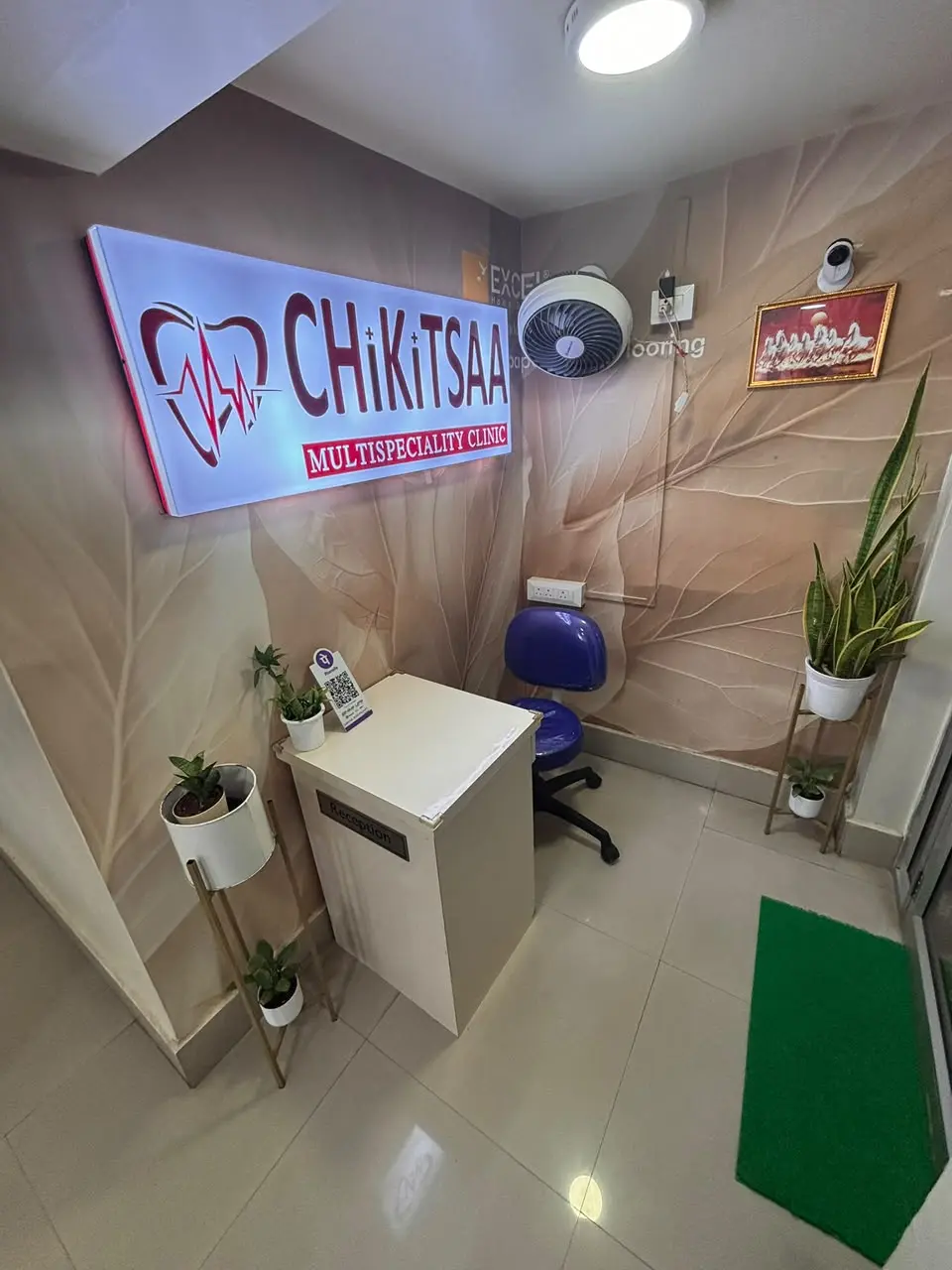 Chikitsaa reception with the clinic’s official sign and logo
