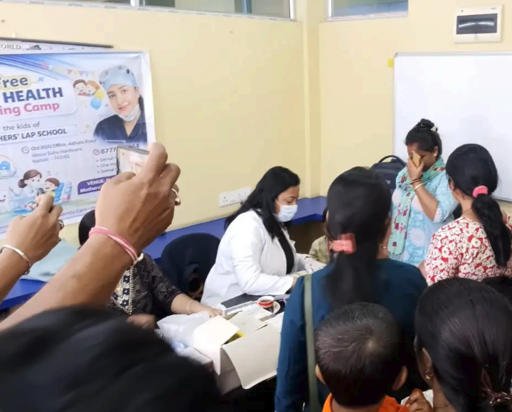 Community health activity at Chikitsaa with families attending a health camp